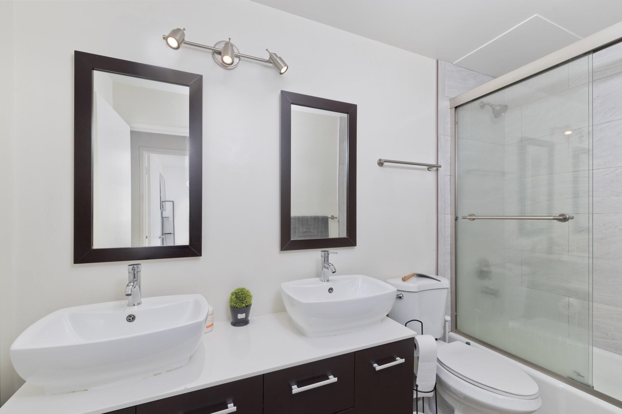 165 Old Mammoth Road, Unit 13 Mammoth Lakes, CA 93546 - Photo 14 of 23 Bathroom featuring a dual vanity with vessel sinks and dark wood-finish cabinetry