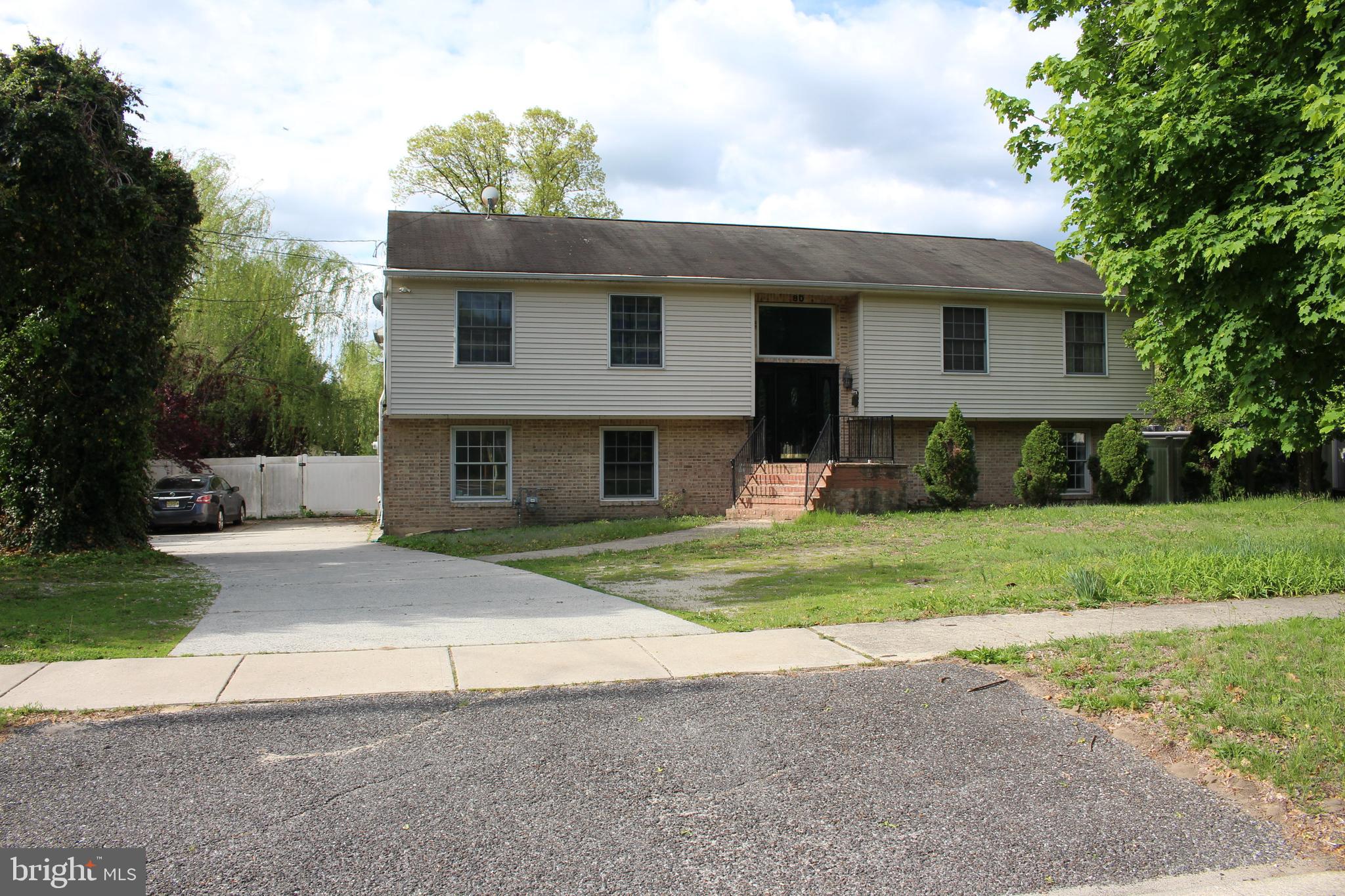 80 Chews Landing Road Clementon, NJ 08021 - Photo 11 of 50 a front view of a house with a yard and trees