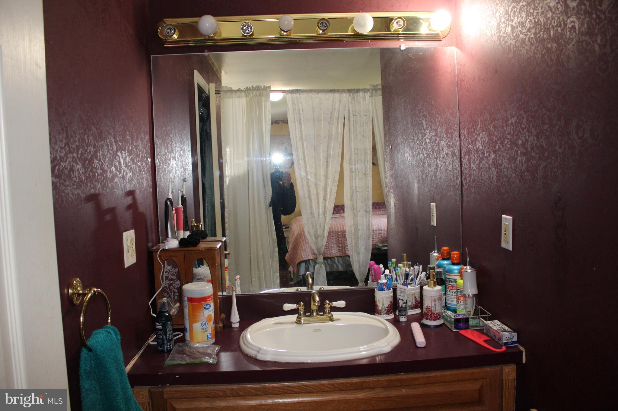 80 Chews Landing Road Clementon, NJ 08021 - Photo 19 of 50 a bathroom with a sink and a mirror