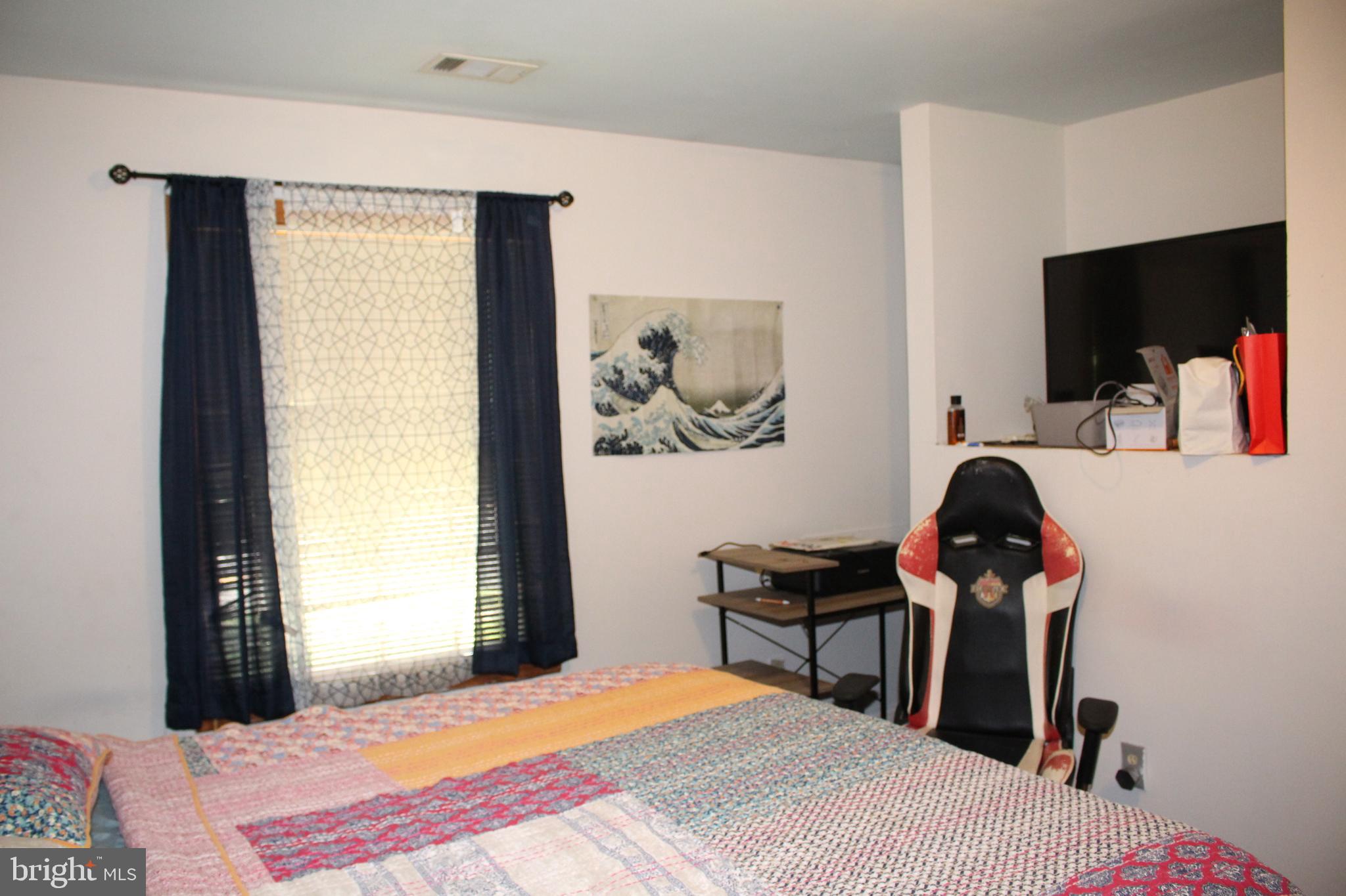 80 Chews Landing Road Clementon, NJ 08021 - Photo 33 of 50 a bedroom with a bed and a flat screen tv