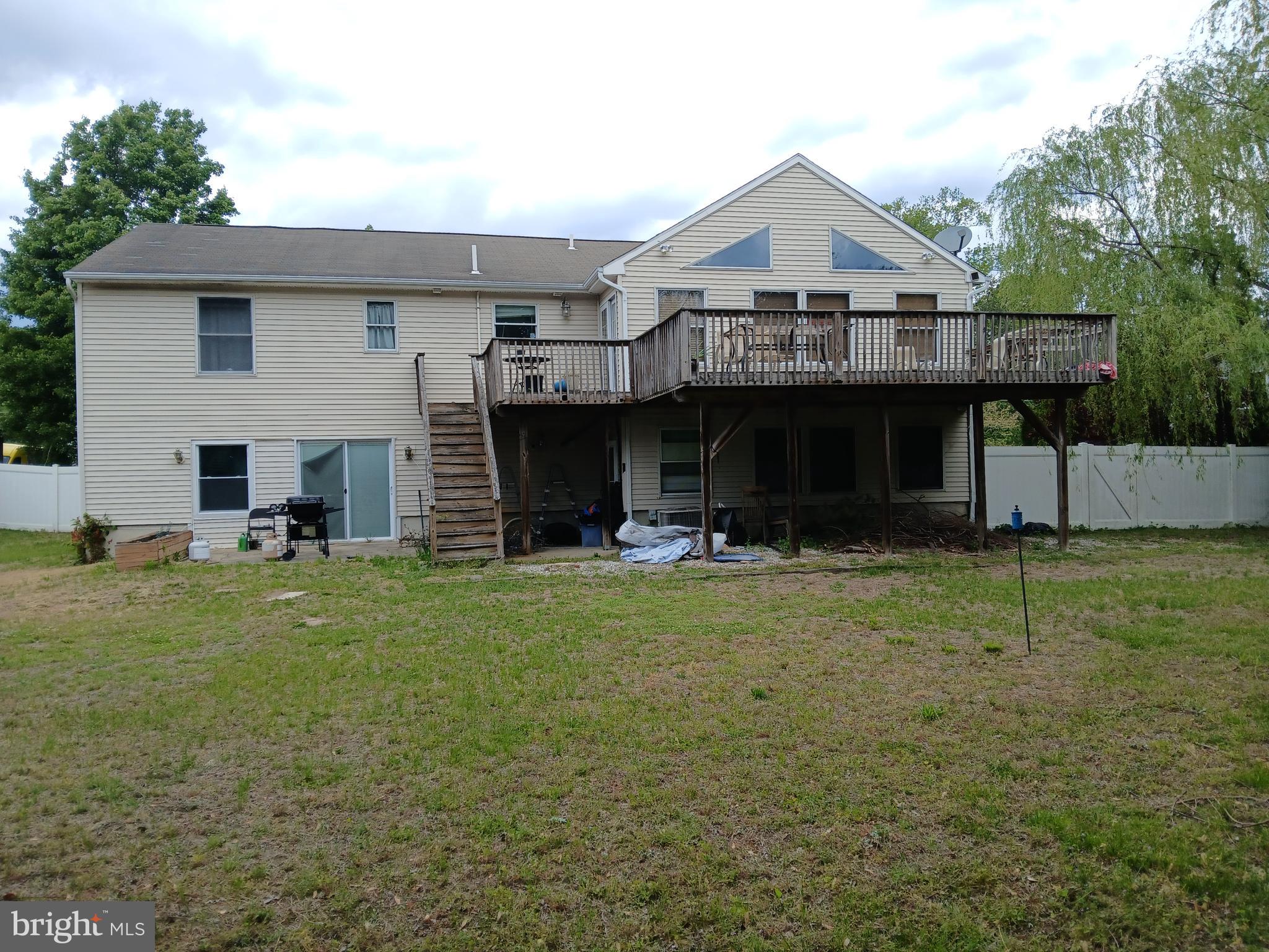 80 Chews Landing Road Clementon, NJ 08021 - Photo 5 of 50 a front view of a house with a garden and plants