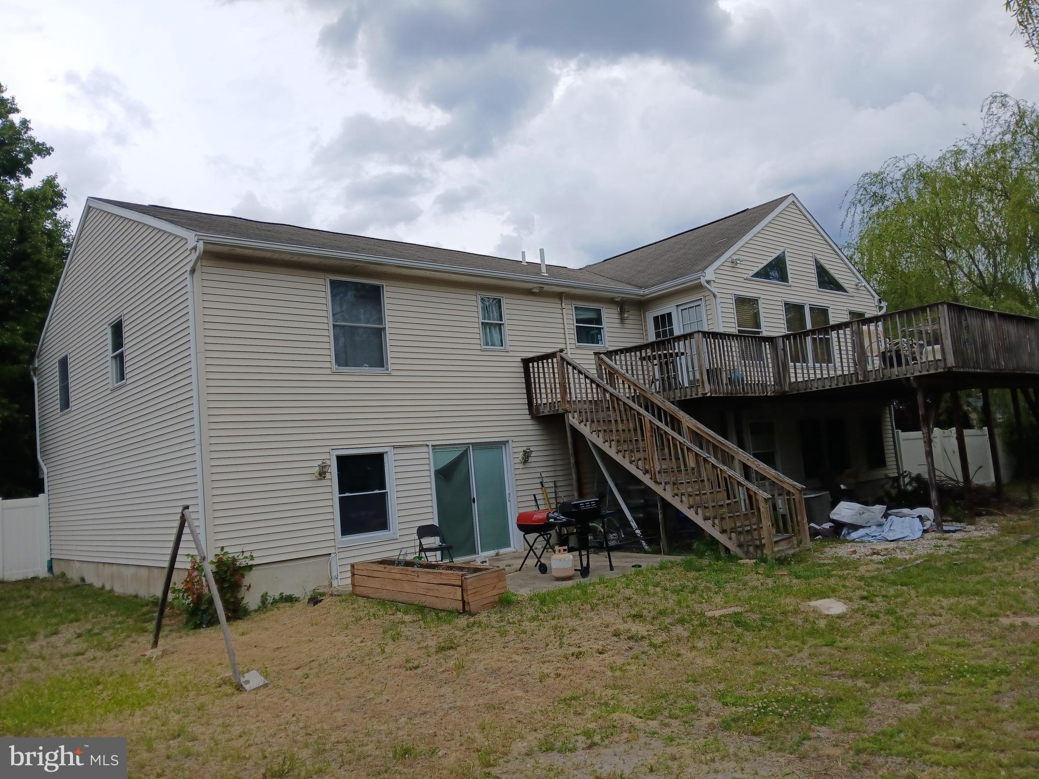 80 Chews Landing Road Clementon, NJ 08021 - Photo 6 of 50 a view of a house with wooden deck and a small yard