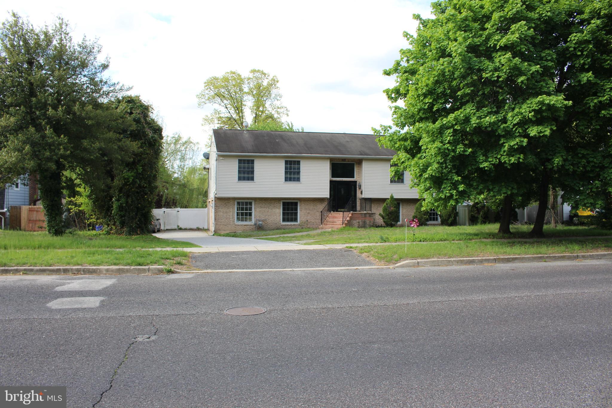 80 Chews Landing Road Clementon, NJ 08021 - Photo 9 of 50 a view of a house with a big yard and large trees