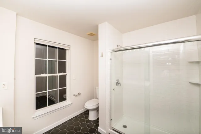 a bathroom with a sink and a large mirror