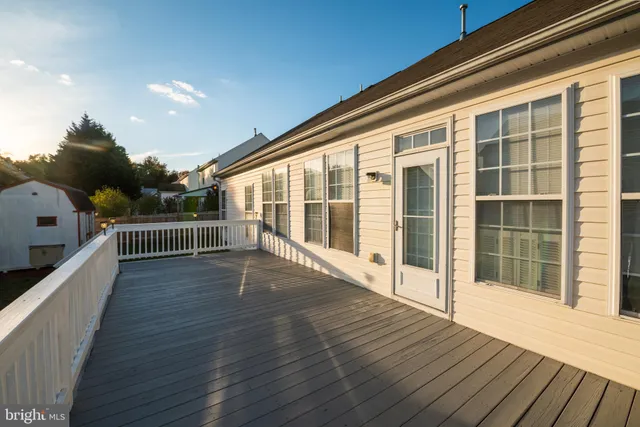 a view of a balcony and yard with wooden floor