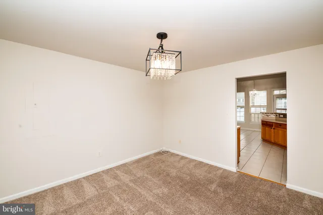 a kitchen with stainless steel appliances a stove a sink and a refrigerator