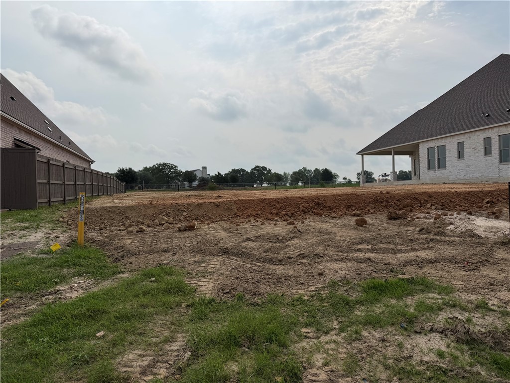 7048 Skipping Rock Path Bryan, TX 77808 - Photo 15 of 16 a view of a house with a yard