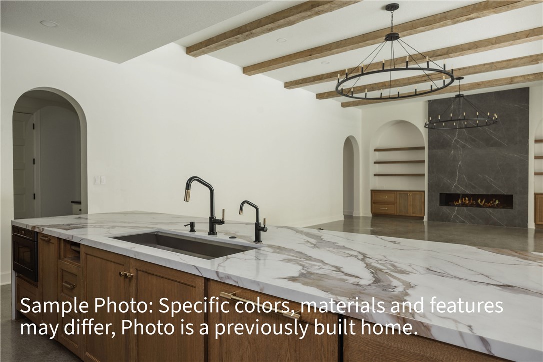 7048 Skipping Rock Path Bryan, TX 77808 - Photo 2 of 16 a kitchen with a sink and a refrigerator