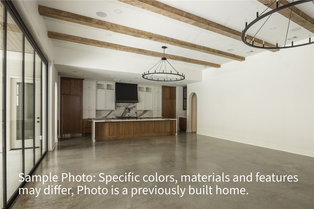 7048 Skipping Rock Path Bryan, TX 77808 - Photo 4 of 16 a view of a living room and a chandelier