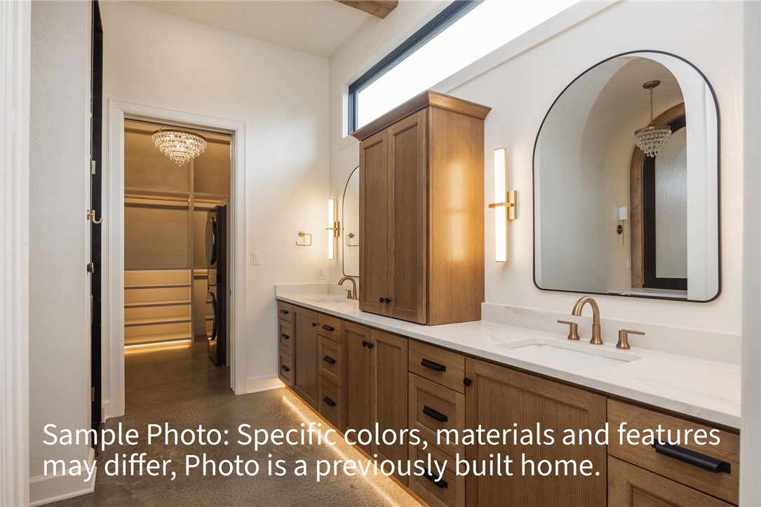 7048 Skipping Rock Path Bryan, TX 77808 - Photo 5 of 16 a bathroom with a granite countertop sink a mirror and a shower