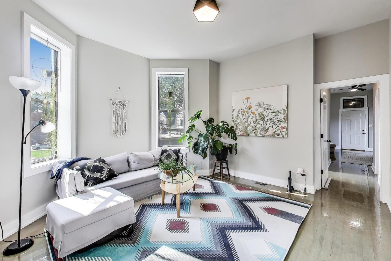 2742 West Polk Street Chicago, IL 60612 - Photo 15 of 50 a living room with furniture potted plant and a window