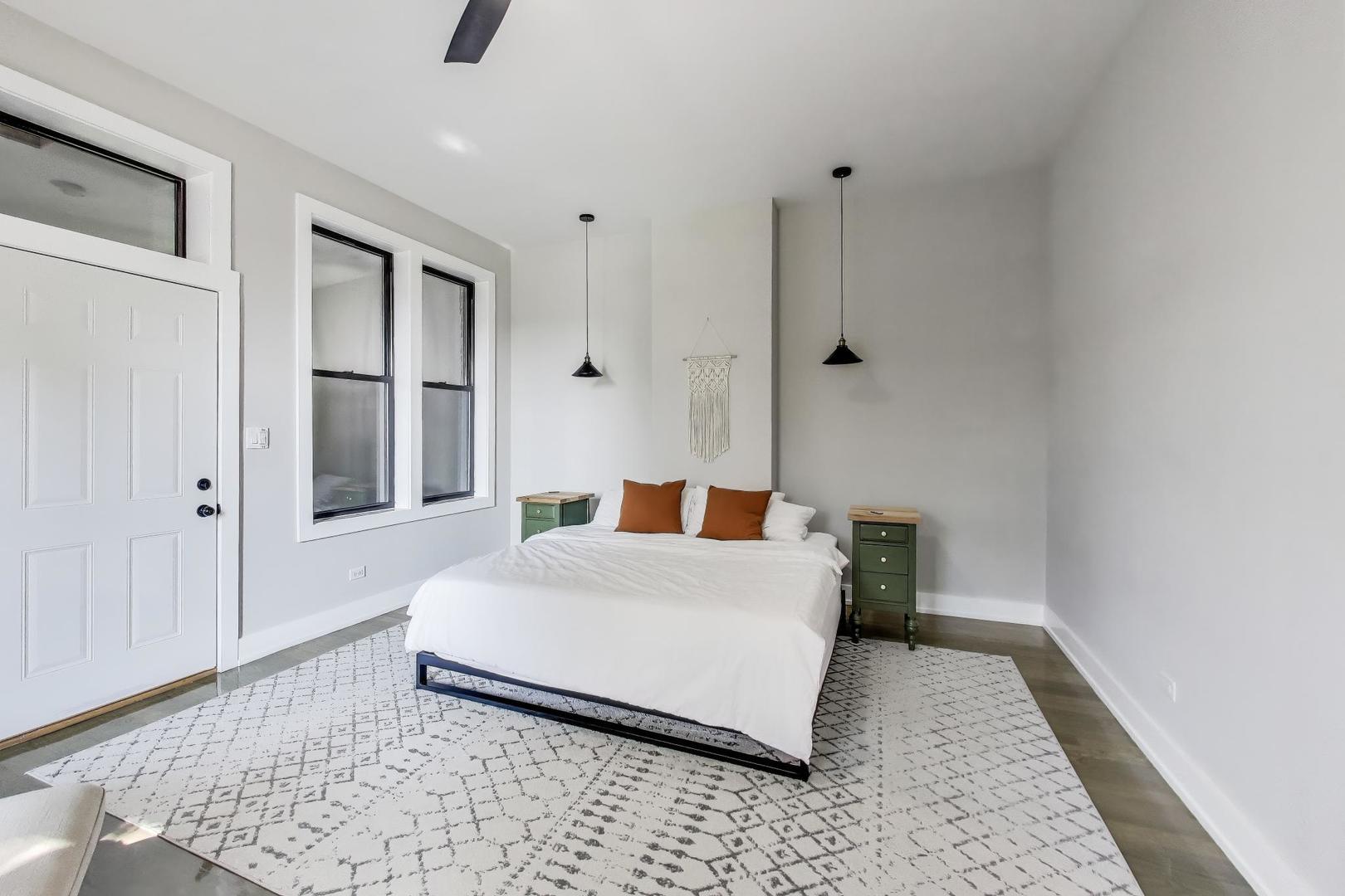 2742 West Polk Street Chicago, IL 60612 - Photo 17 of 50 a bedroom with a bed and a rug