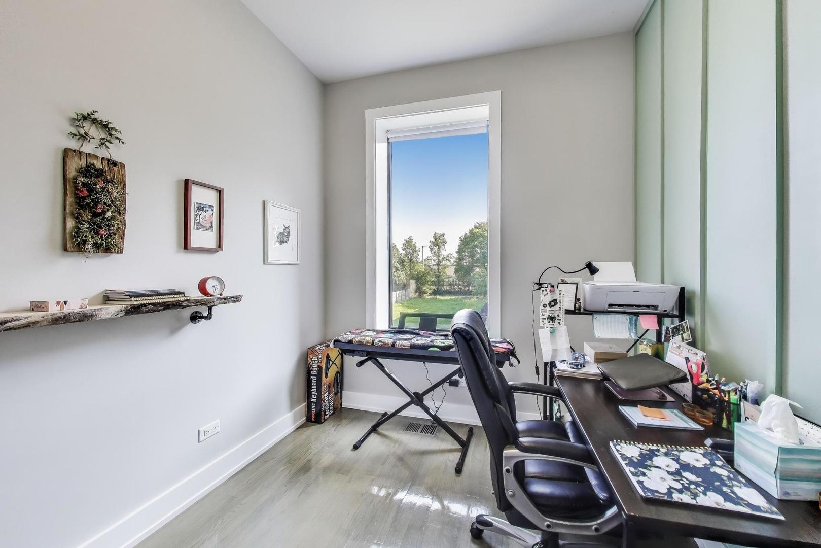 2742 West Polk Street Chicago, IL 60612 - Photo 24 of 50 a view of a workspace with furniture and lounge chair