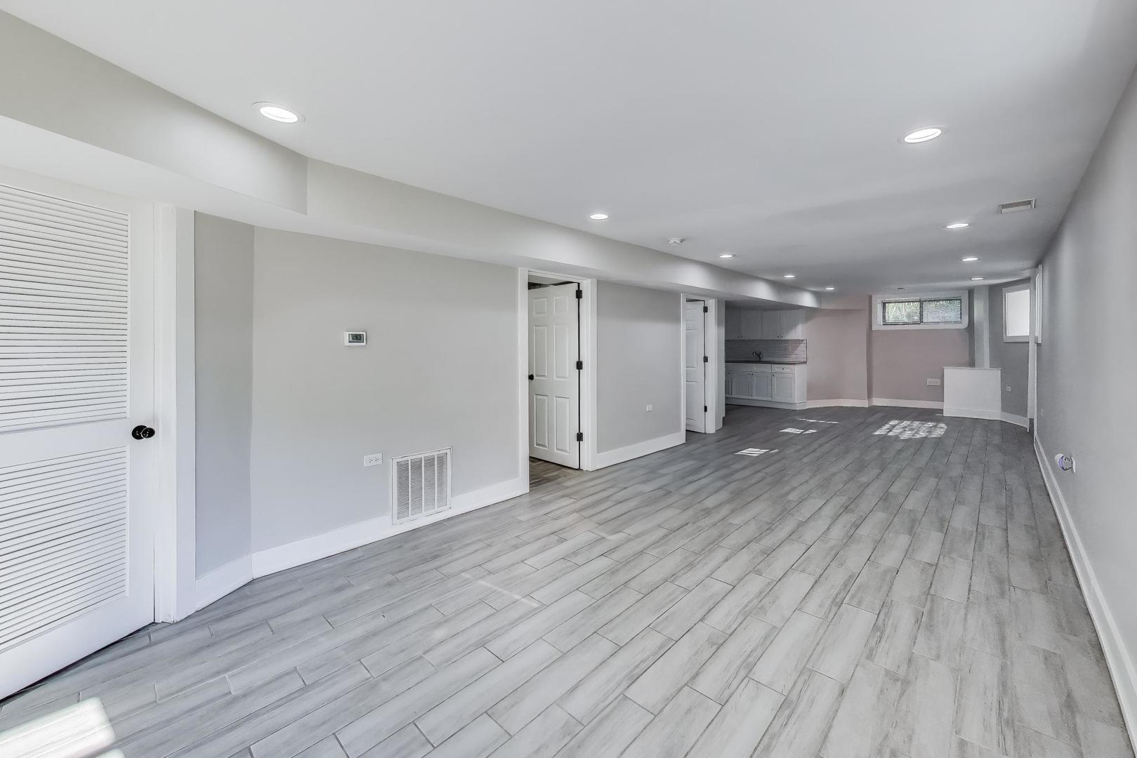 2742 West Polk Street Chicago, IL 60612 - Photo 27 of 50 a view of empty room with wooden floor