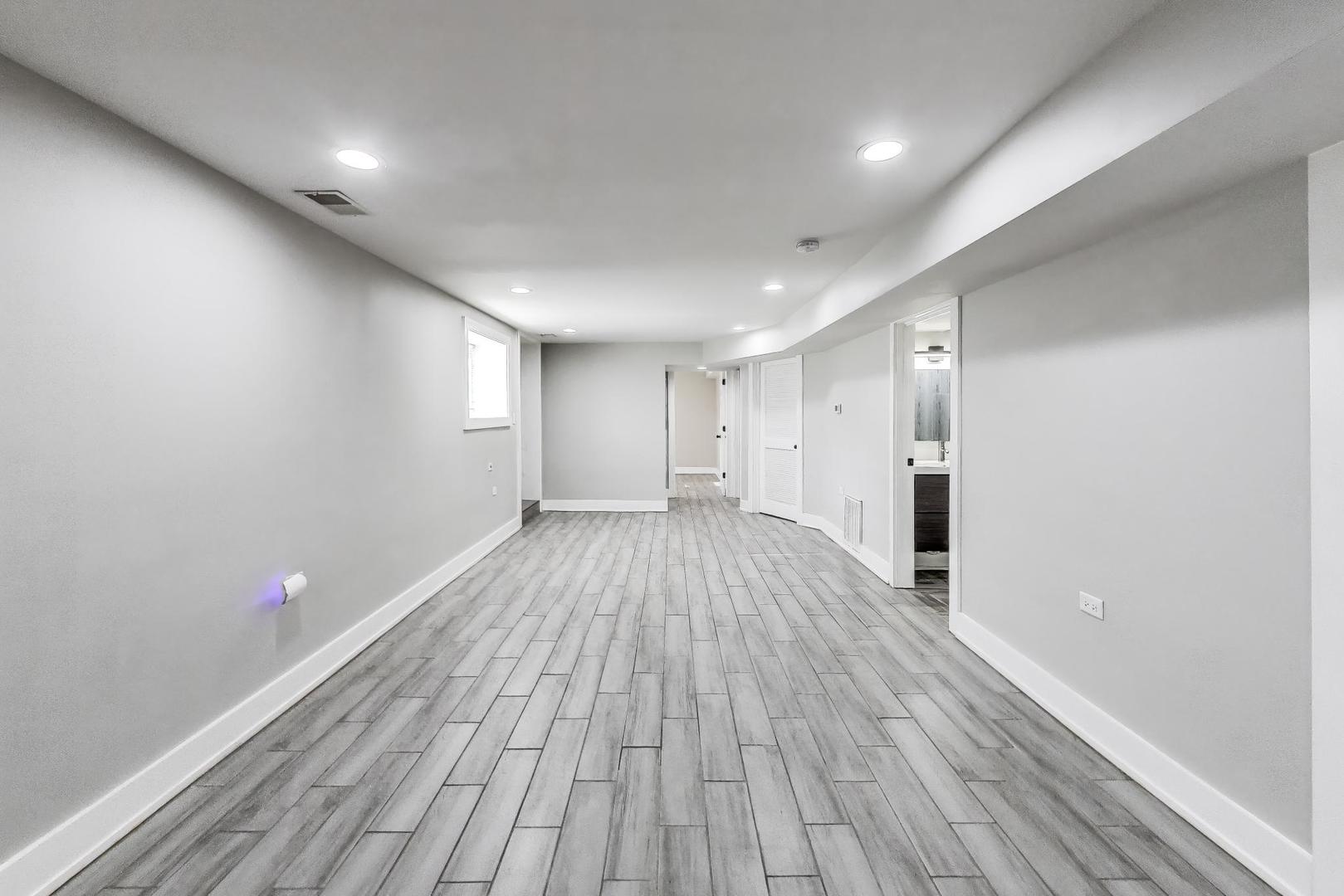 2742 West Polk Street Chicago, IL 60612 - Photo 28 of 50 a view of empty room with wooden floor