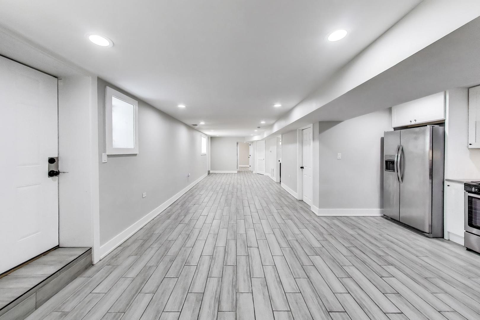 2742 West Polk Street Chicago, IL 60612 - Photo 30 of 50 a view of empty room with wooden floor