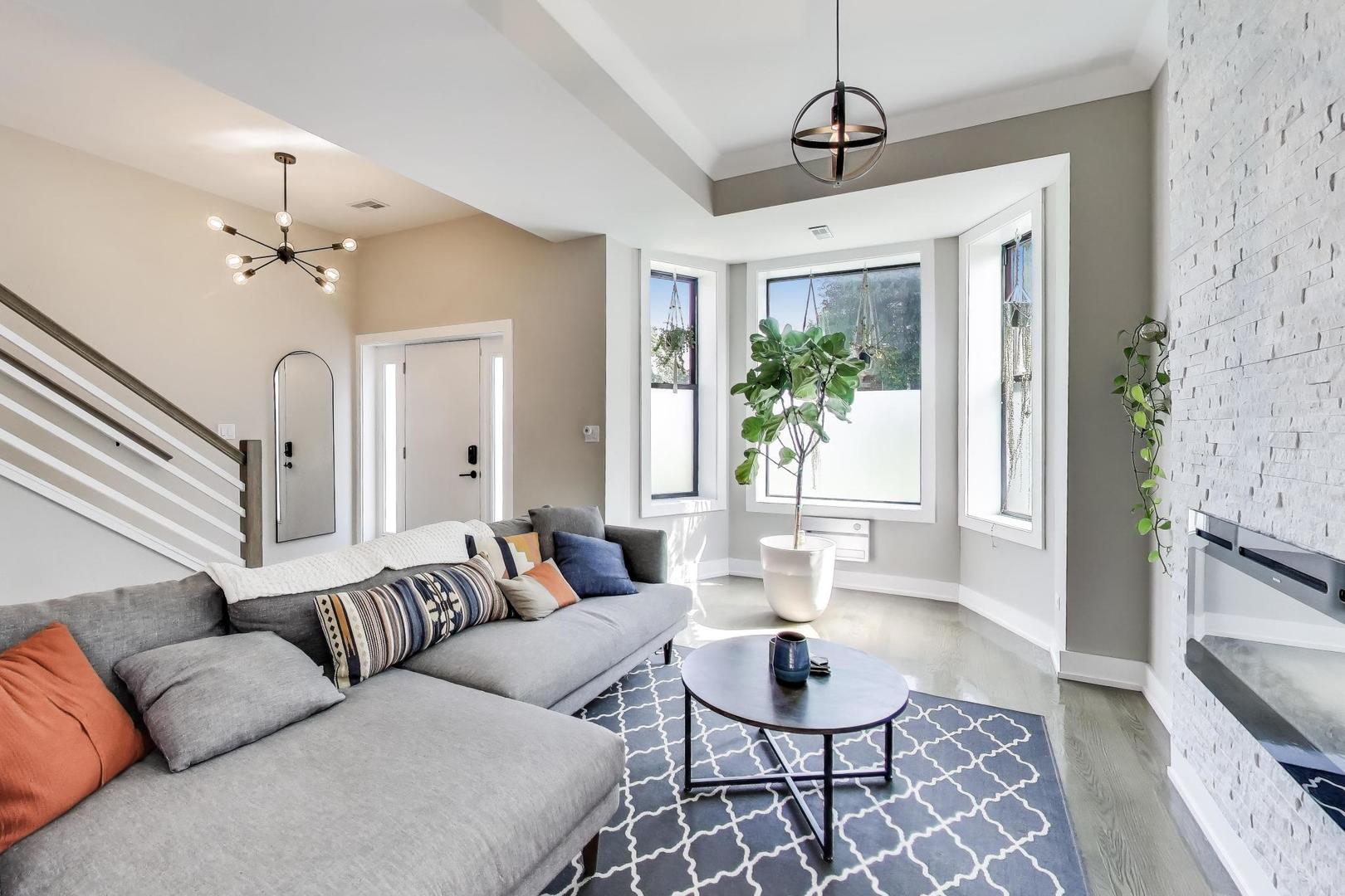 2742 West Polk Street Chicago, IL 60612 - Photo 3 of 50 a living room with furniture and a window