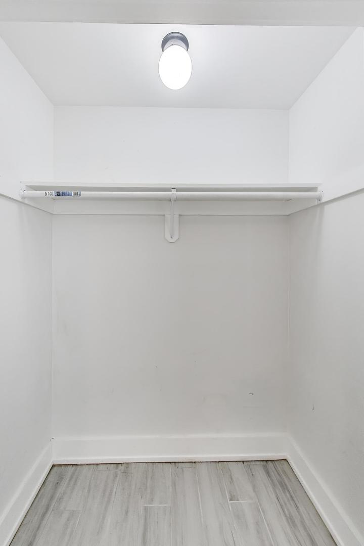 2742 West Polk Street Chicago, IL 60612 - Photo 38 of 50 a view of storage and utility room with wooden floor