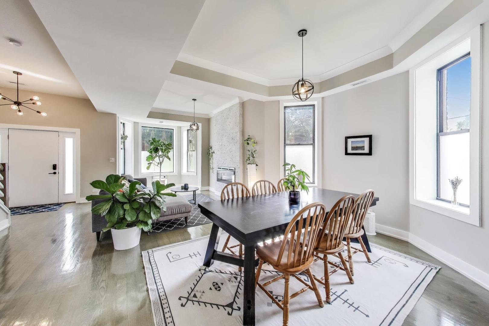 2742 West Polk Street Chicago, IL 60612 - Photo 4 of 50 a view of a dining room with furniture window and wooden floor