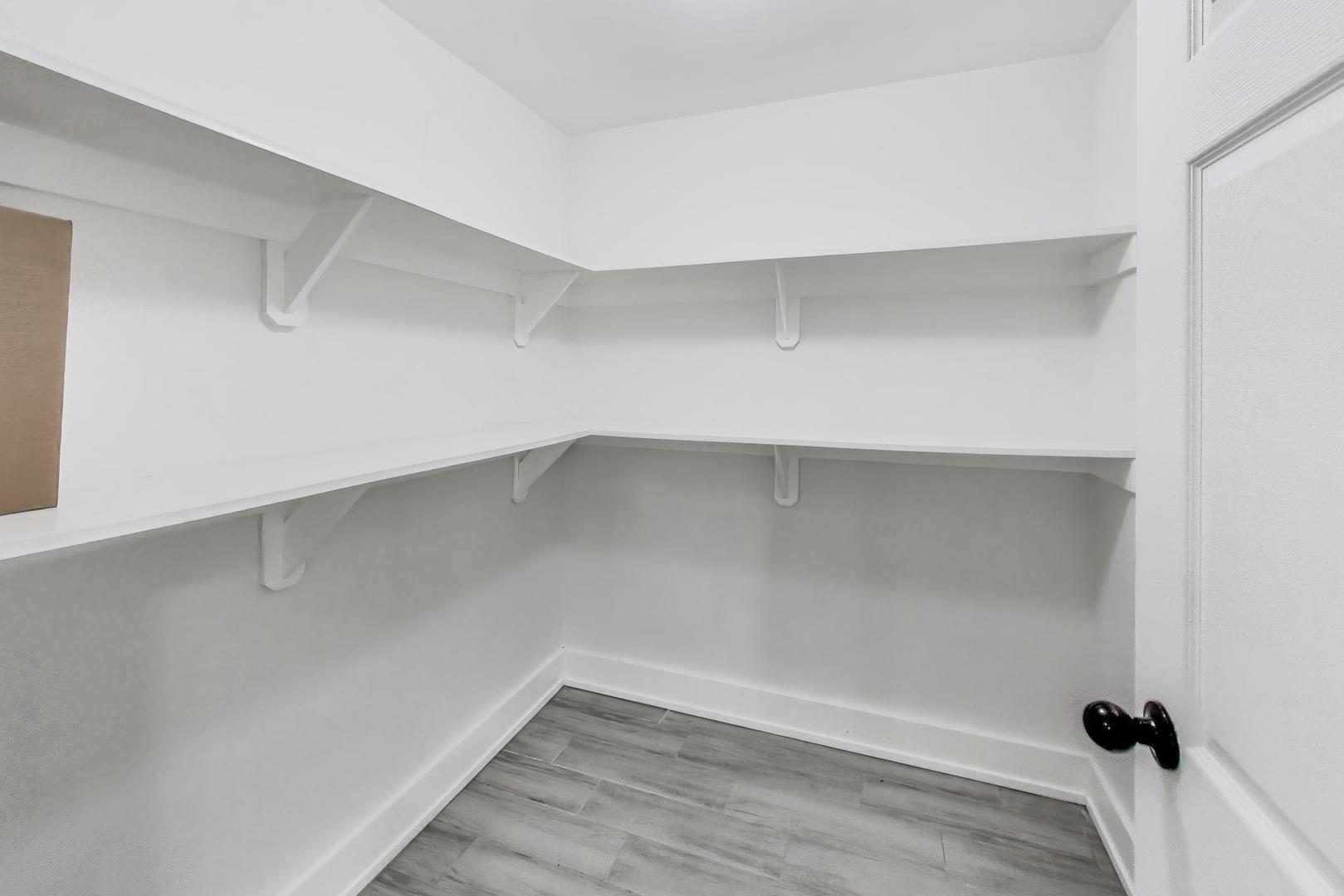 2742 West Polk Street Chicago, IL 60612 - Photo 42 of 50 a view of a room with wooden floor