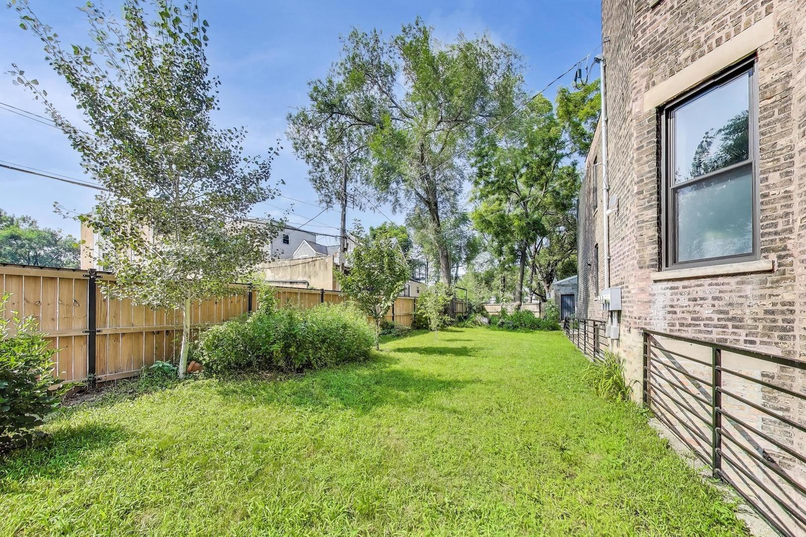 2742 West Polk Street Chicago, IL 60612 - Photo 44 of 50 a view of house with backyard