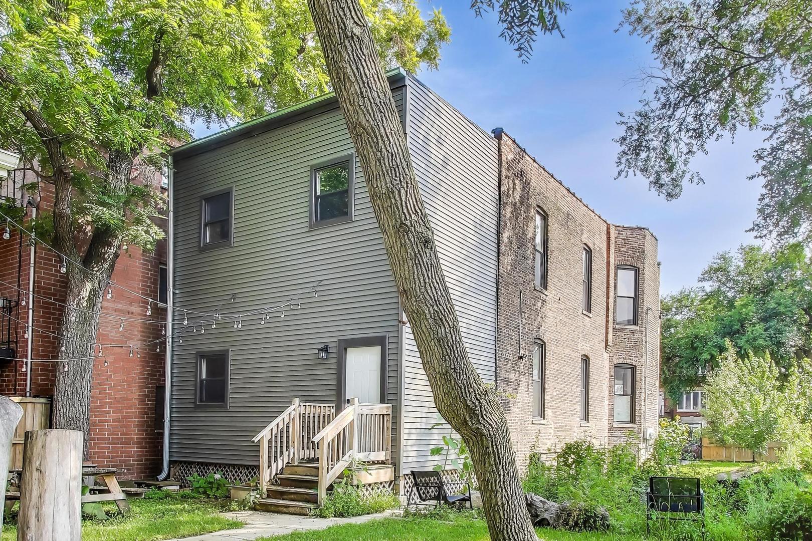 2742 West Polk Street Chicago, IL 60612 - Photo 46 of 50 a front view of a house with garden