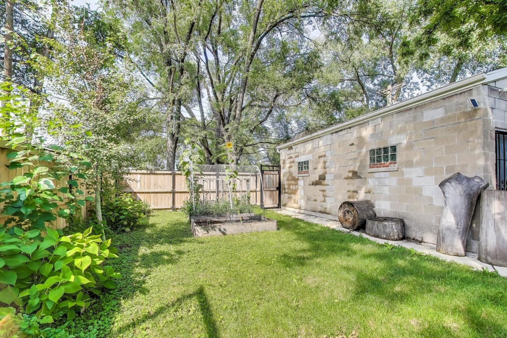 2742 West Polk Street Chicago, IL 60612 - Photo 48 of 50 a backyard of a house with seating and yard