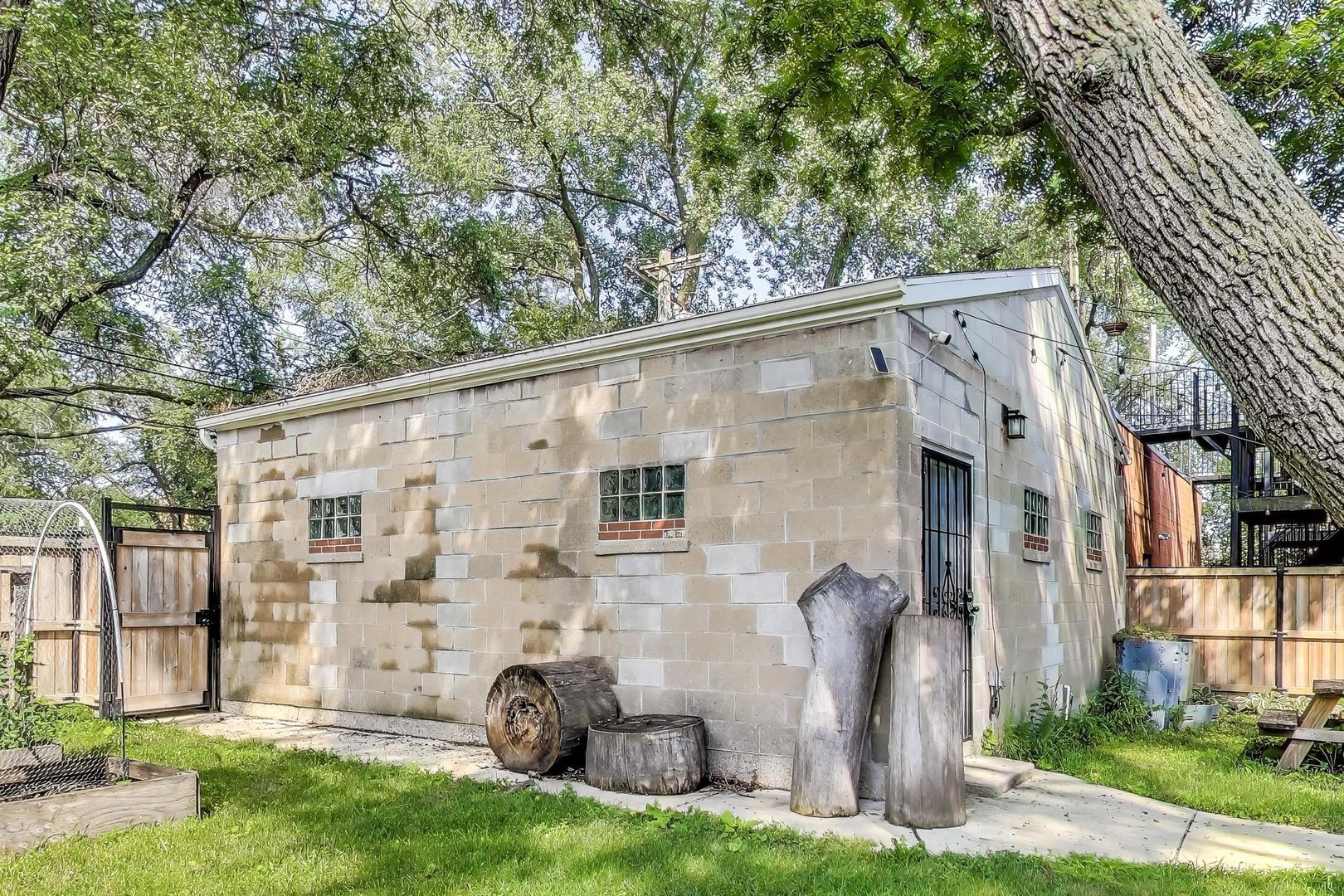 2742 West Polk Street Chicago, IL 60612 - Photo 50 of 50 a view of a white house with a big yard and large tree