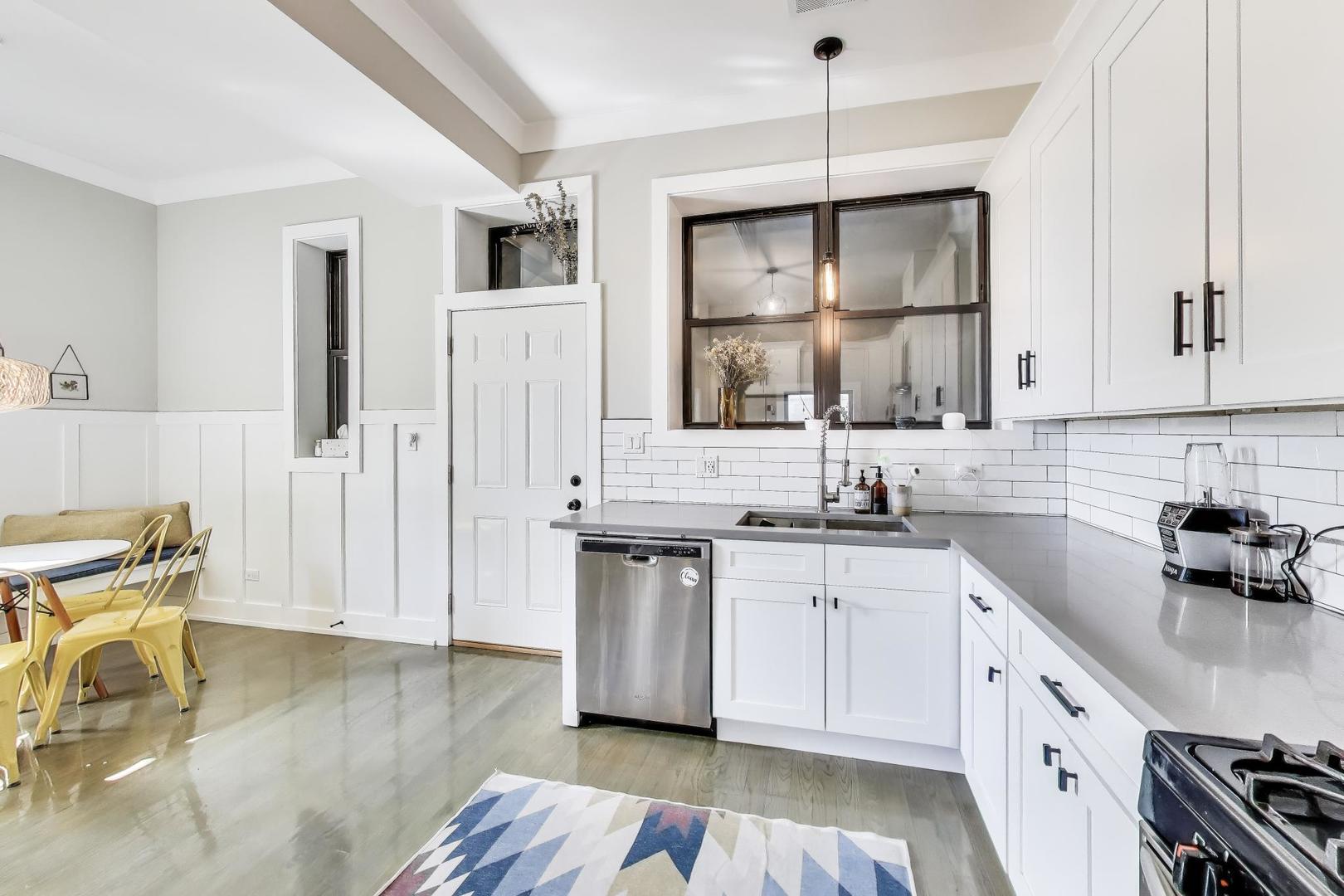 2742 West Polk Street Chicago, IL 60612 - Photo 6 of 50 a kitchen with a sink cabinets and window