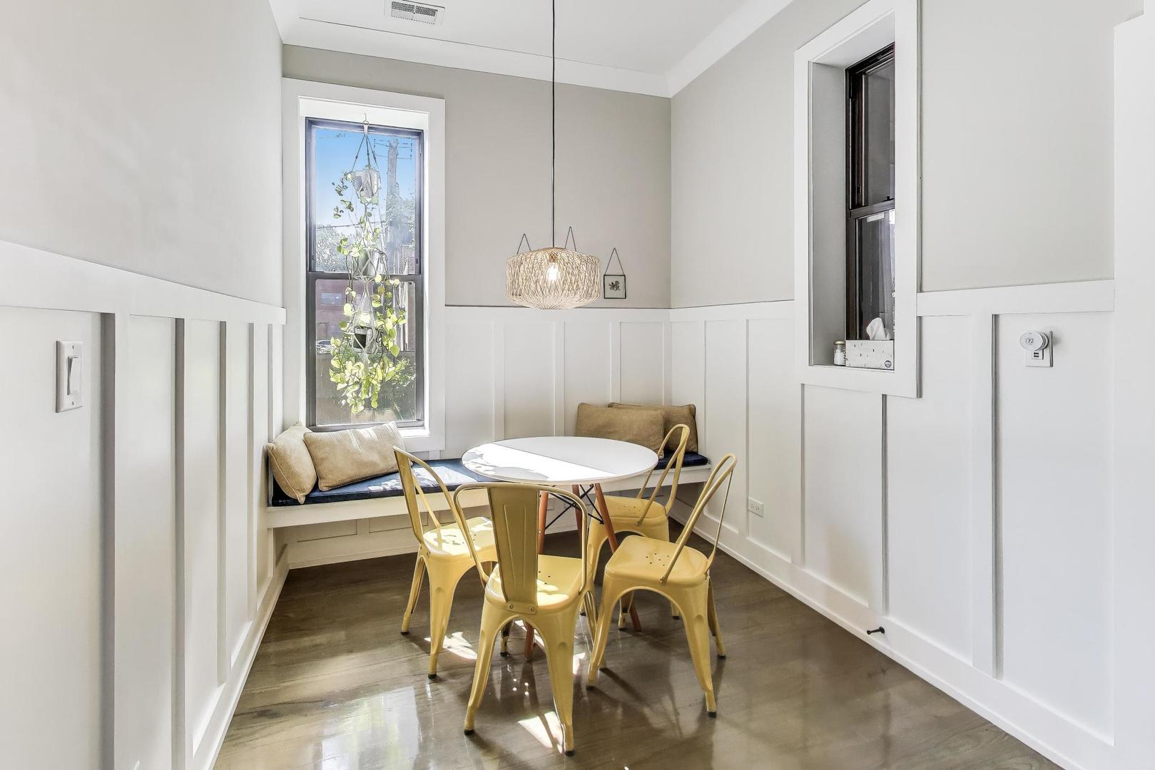 2742 West Polk Street Chicago, IL 60612 - Photo 8 of 50 a view of a dining room with furniture and a window