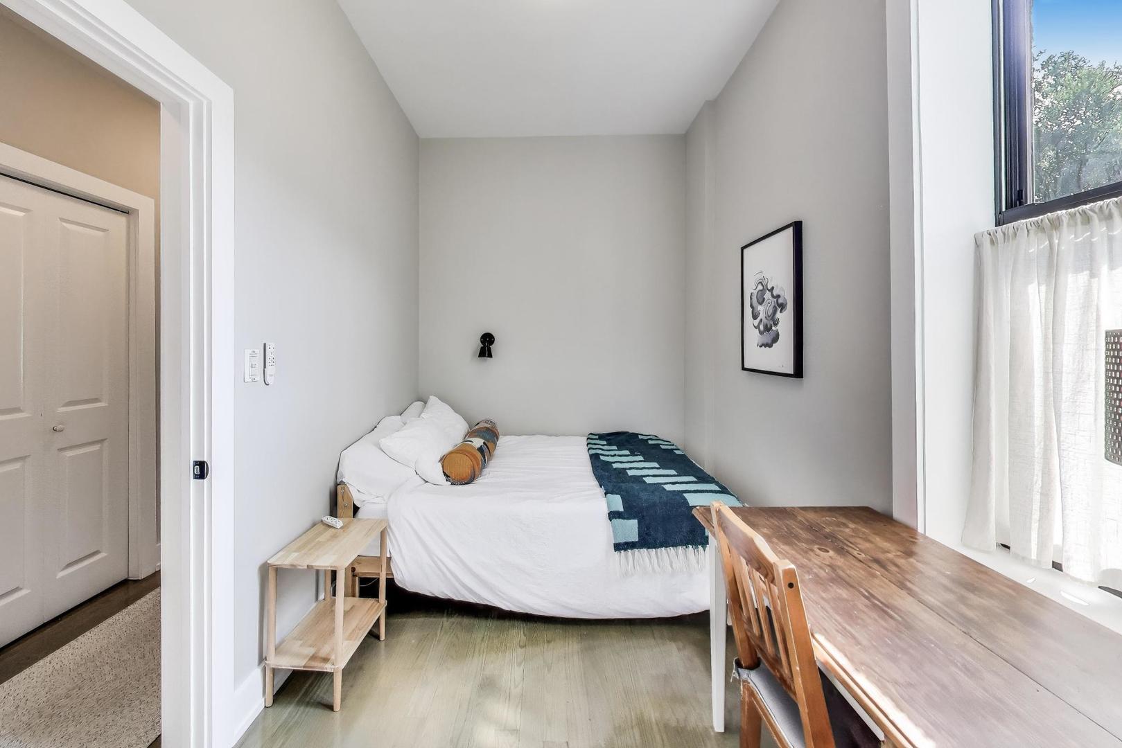 2742 West Polk Street Chicago, IL 60612 - Photo 9 of 50 a bedroom with a bed and wooden floor