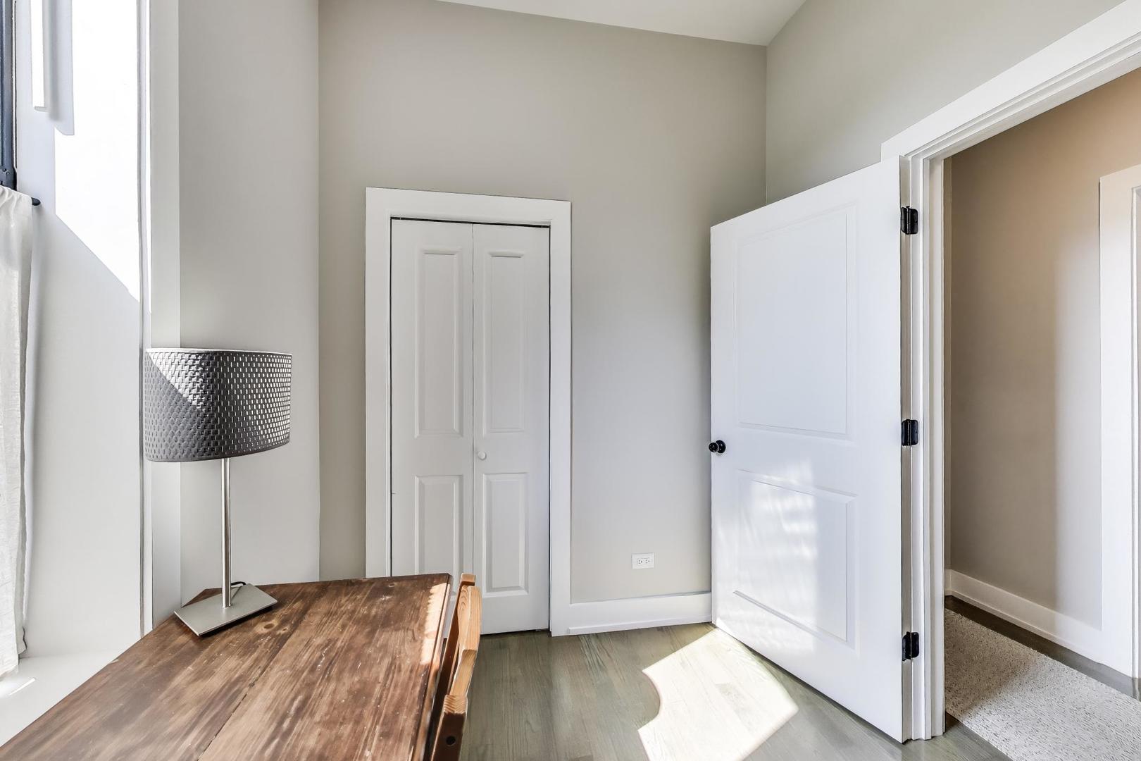 2742 West Polk Street Chicago, IL 60612 - Photo 10 of 50 a view of empty room with wooden floor