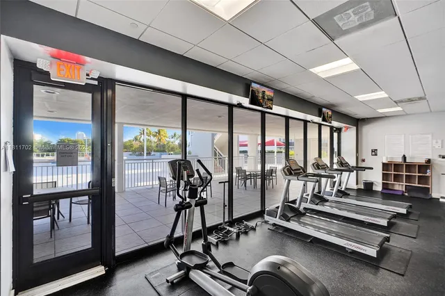 a bathroom with a granite countertop shower and a door