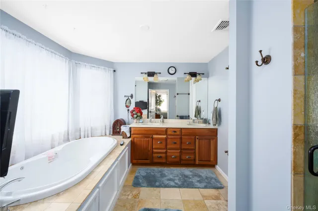 a view of a patio with a dining table and chairs with wooden floor
