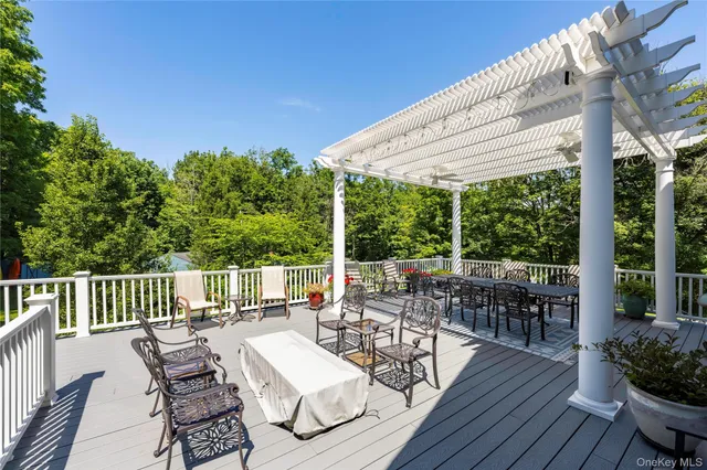 a living room with furniture pool table and a window