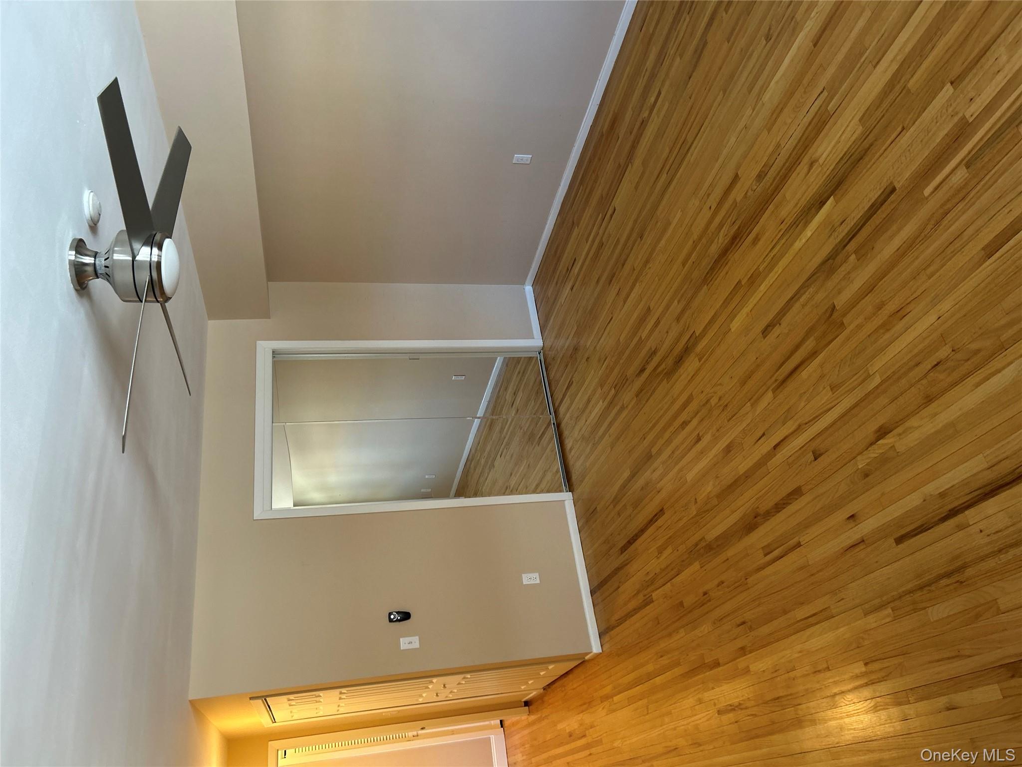 135 West Nyack Road, Unit 111 Nanuet, NY 10954 - Photo 11 of 16 Unfurnished bedroom featuring light wood-type flooring, a closet, and ceiling fan
