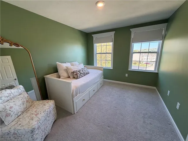 a bed room with furniture and a window
