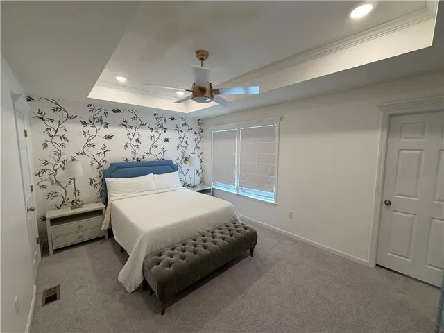 a bedroom with a bed and a walk in closet