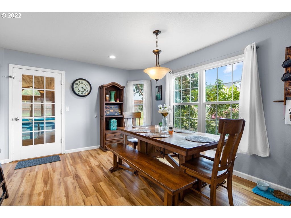 1908 North 4th Way Ridgefield, WA 98642 - Photo 15 of 32 a view of a dining room with furniture window and outside view