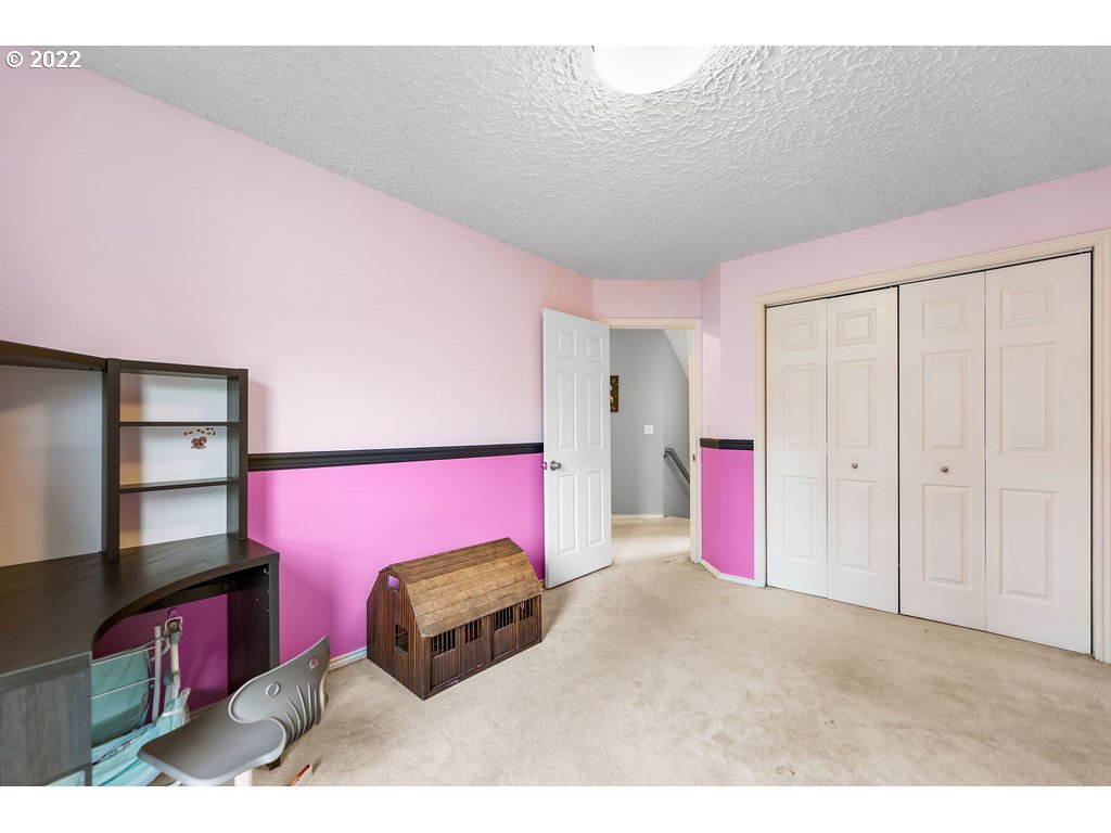 1908 North 4th Way Ridgefield, WA 98642 - Photo 24 of 32 a bedroom with furniture and a dresser