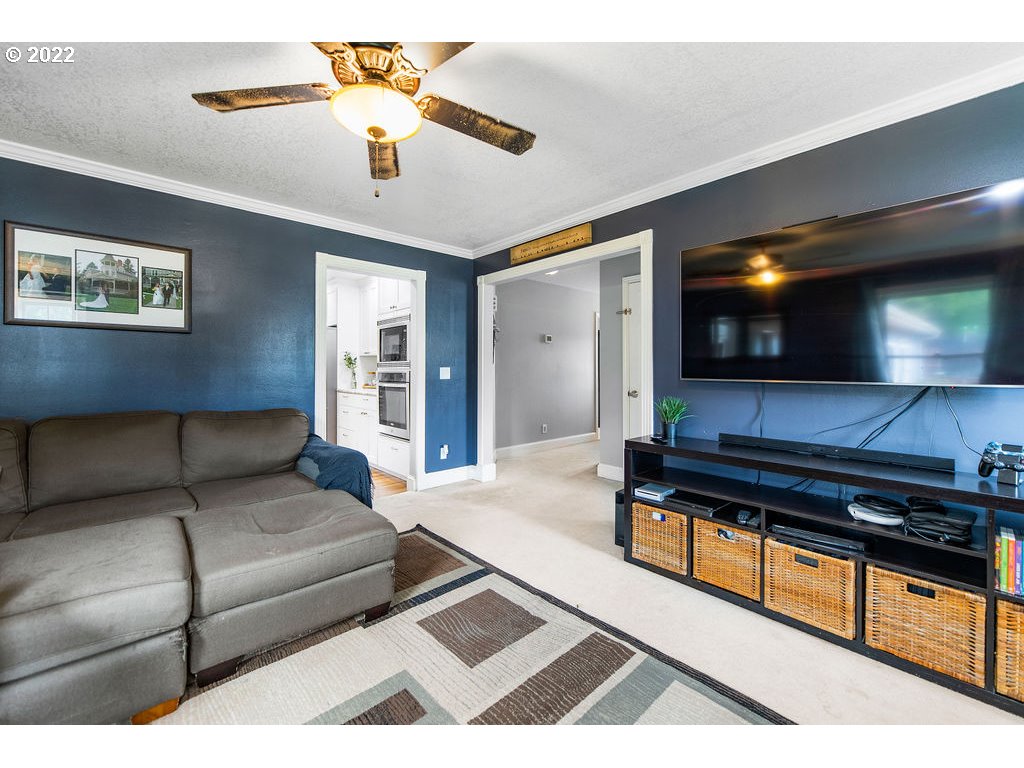 1908 North 4th Way Ridgefield, WA 98642 - Photo 10 of 32 a living room with furniture and a flat screen tv