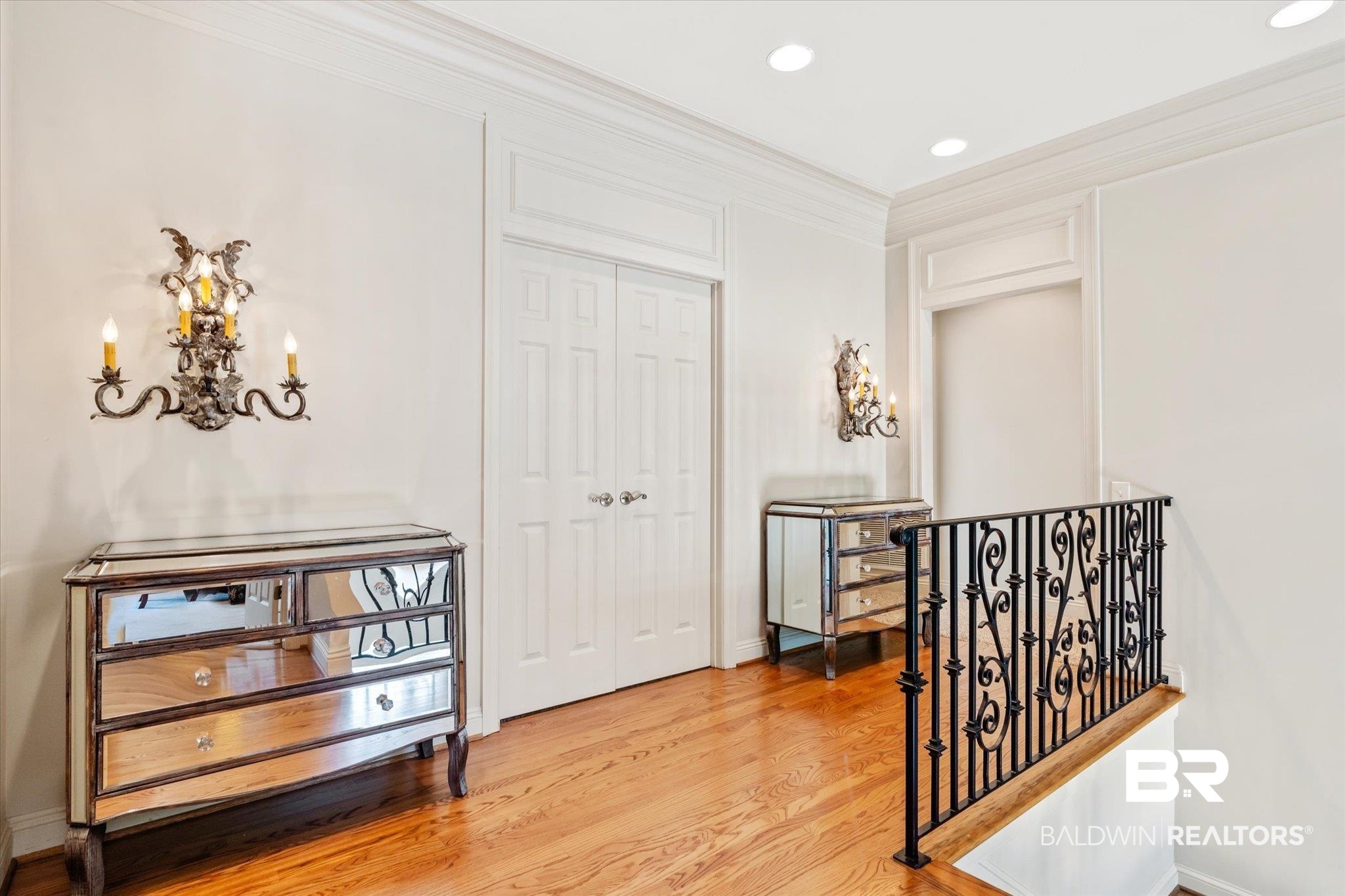 3963 Wimbledon Park Mobile, AL 36608 - Photo 32 of 51 Corridor with crown molding, a chandelier, and hardwood / wood-style flooring