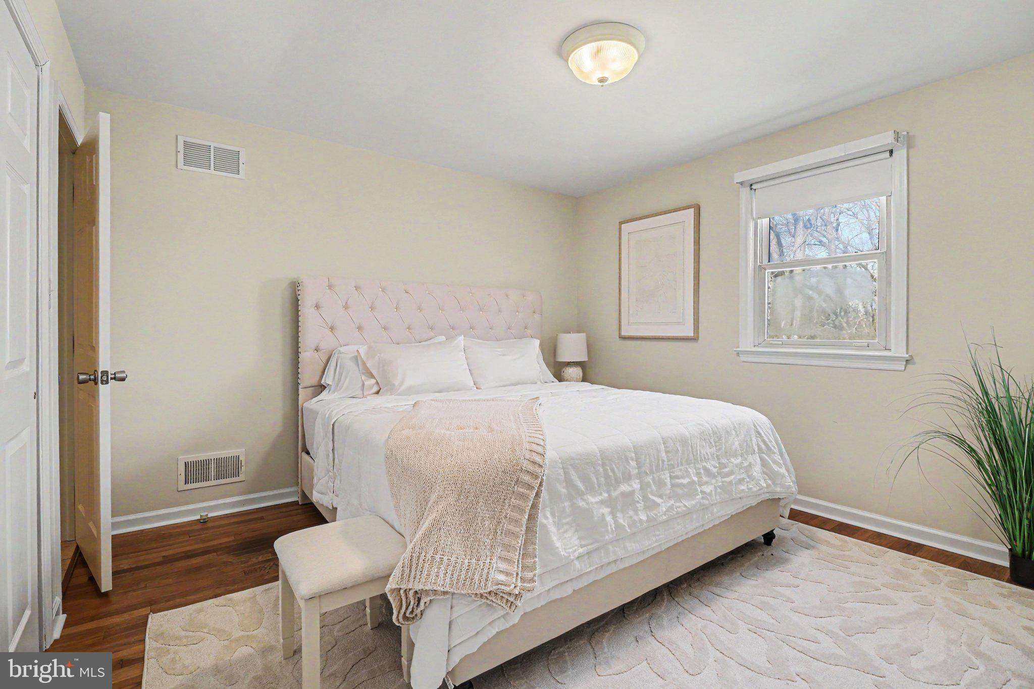 913 Stehman Road Millersville, PA 17551 - Photo 13 of 38 a bedroom with a bed and wooden floor