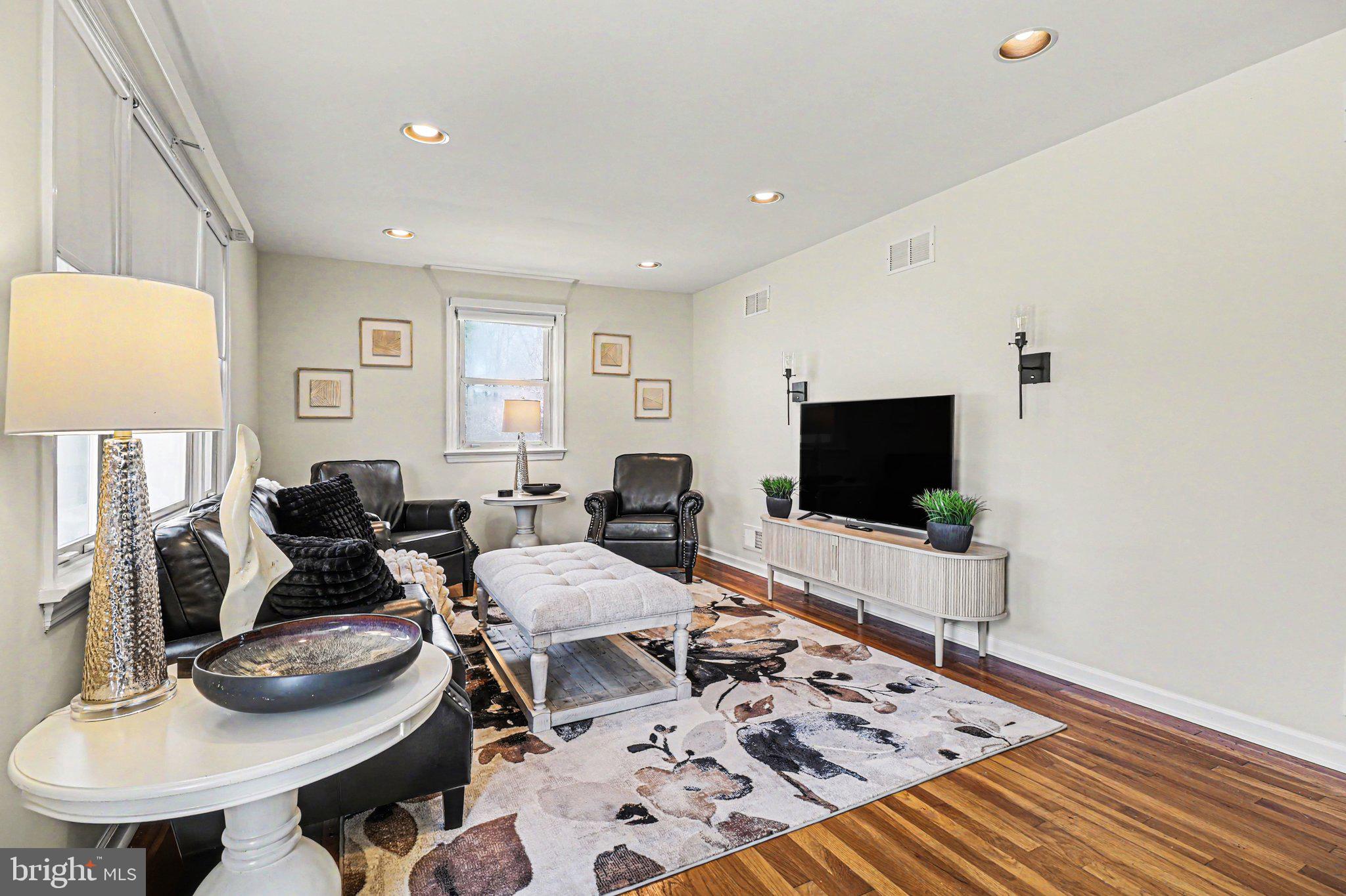 913 Stehman Road Millersville, PA 17551 - Photo 2 of 38 a living room with furniture and a flat screen tv