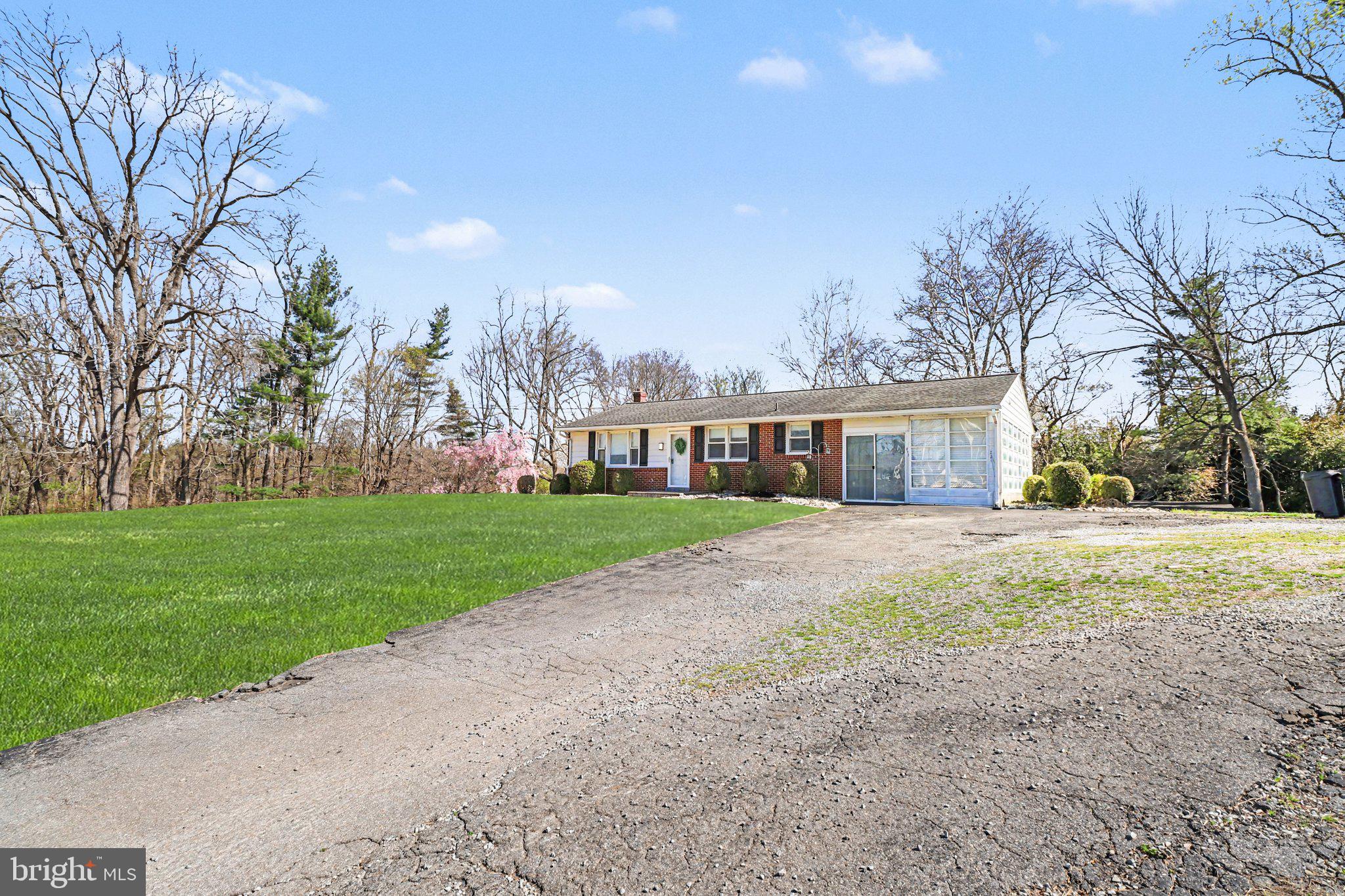 913 Stehman Road Millersville, PA 17551 - Photo 21 of 38 a front view of house with yard and trees