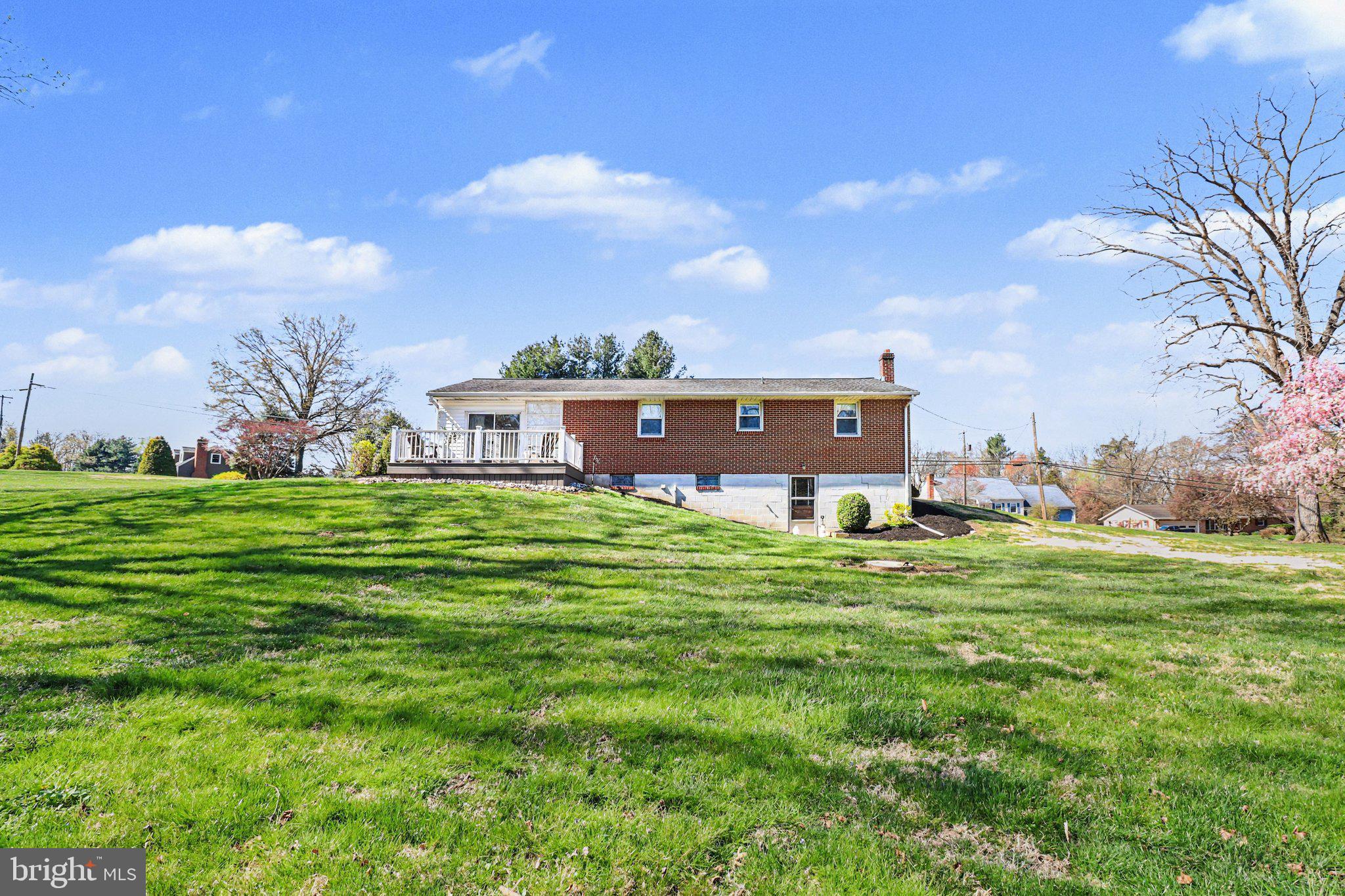913 Stehman Road Millersville, PA 17551 - Photo 23 of 38 a backyard of a house with a garden and barbeque oven