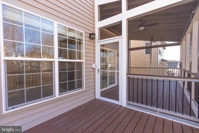 a view of an empty room with a fireplace and cabinet