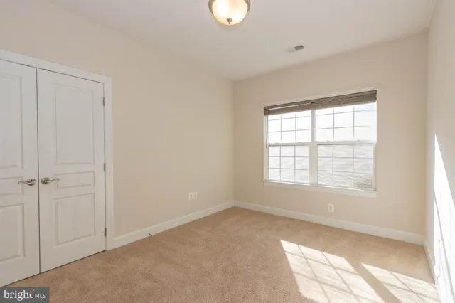 a view of empty room with windows