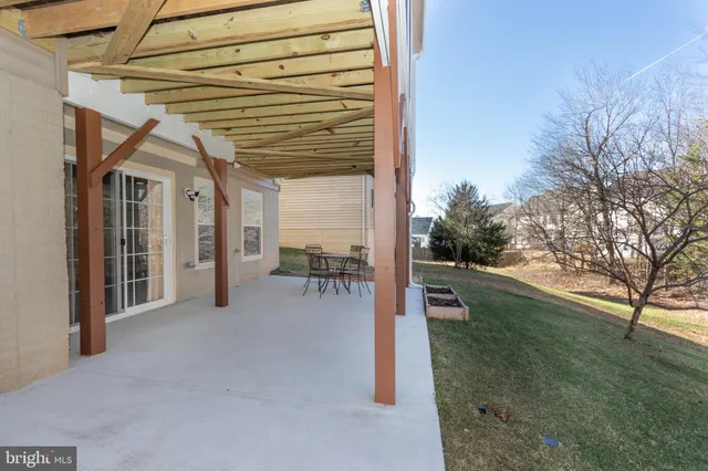 a view of a hallway with wooden floor and entryway
