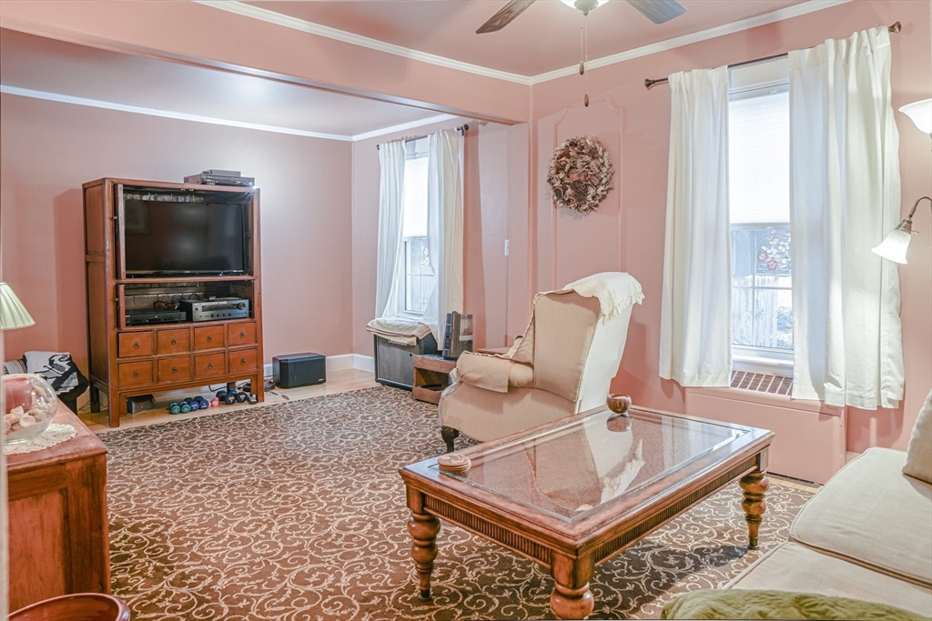42 Bisson Street Beverly, MA 01915 - Photo 11 of 28 a living room with furniture and a flat screen tv